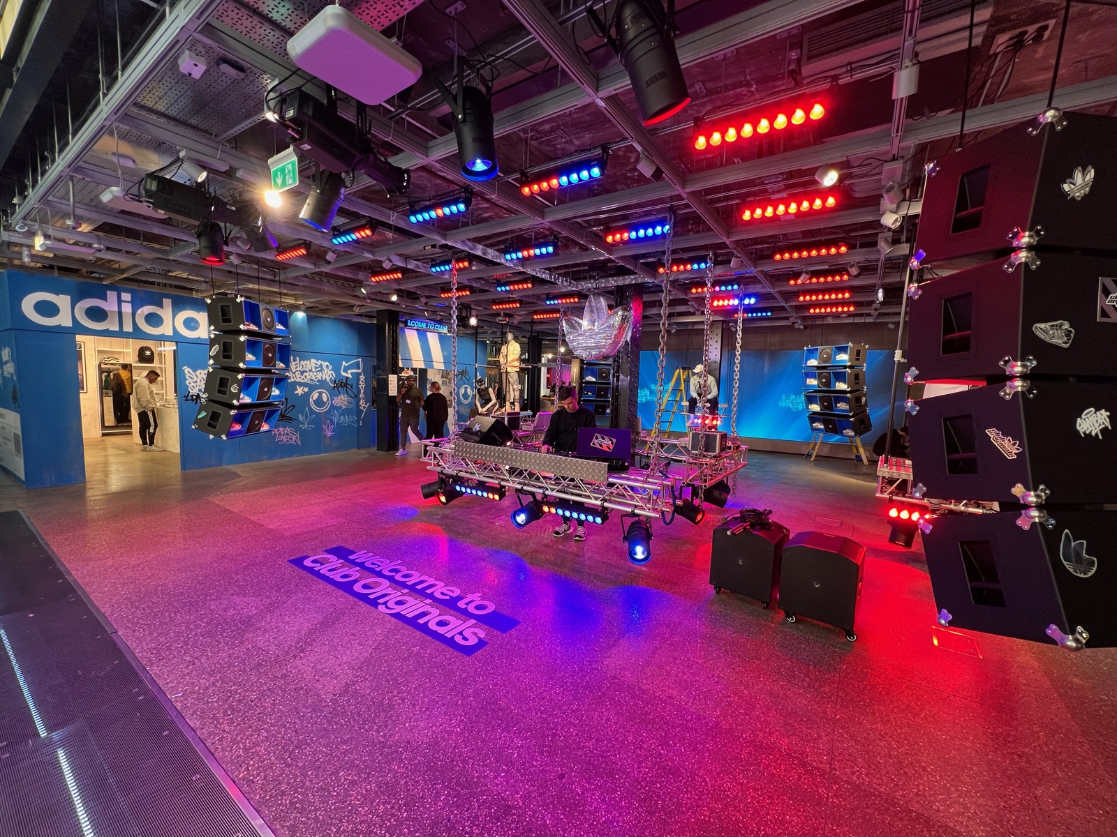 Branded retail installation build with rigged truss and moving lights